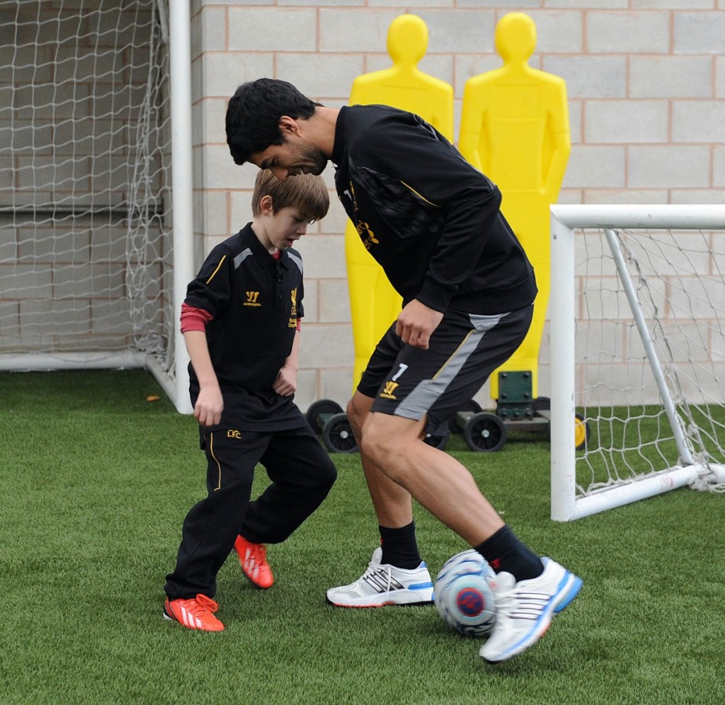 Luis and Finn have a kickabout